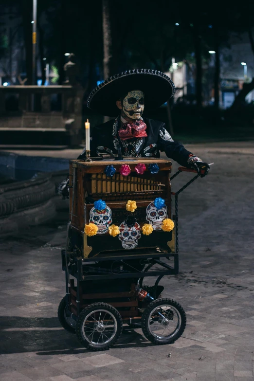 a woman on a bike with a skeleton on the back