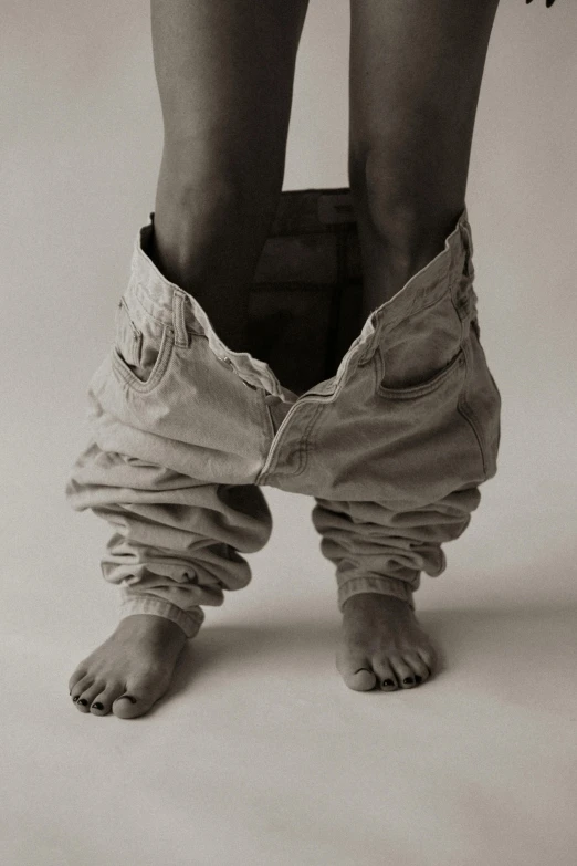 a person is shown with jeans tied to the bottom