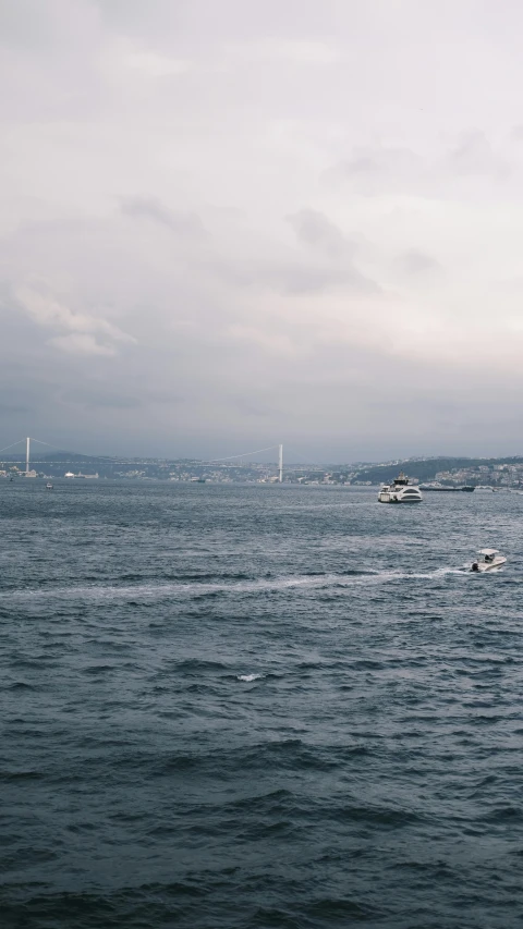 a body of water with a boat in the distance