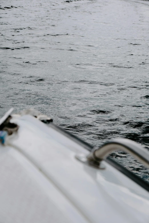 a man riding a boat near the ocean