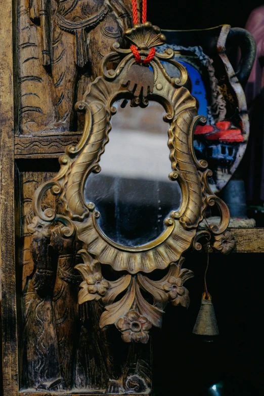 a mirror with a bird decoration on it