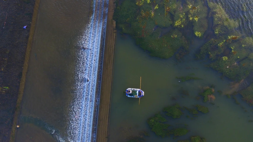 two boats are anchored near the shore