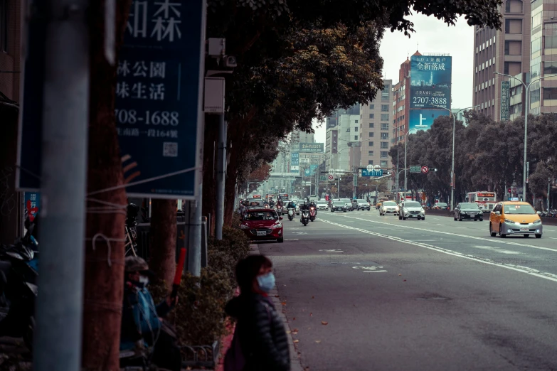 a busy street with lots of buildings and cars