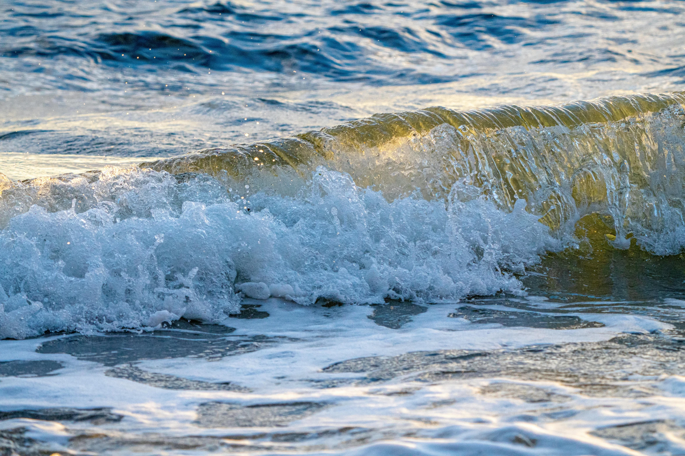 an artistic picture of waves crashing against a shore