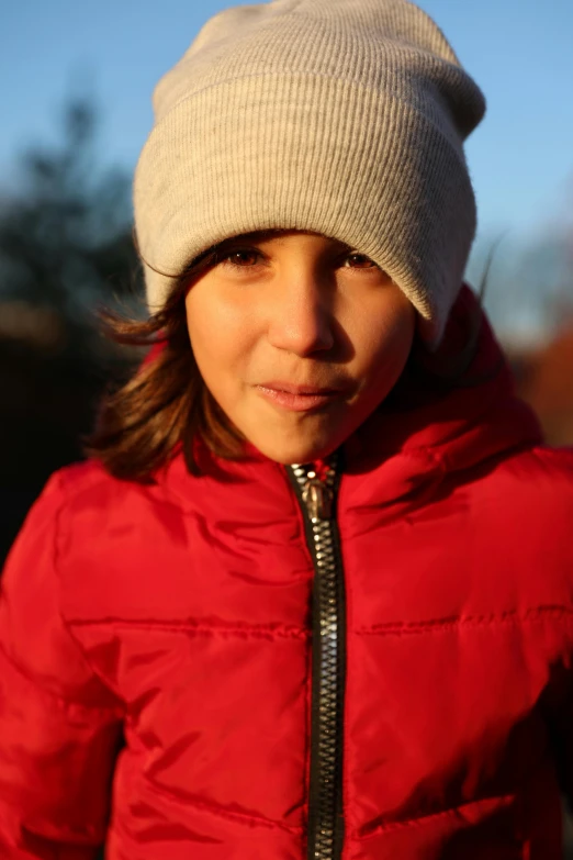 a  with a red coat and a hat