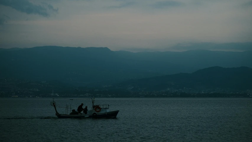 the fishermen are heading toward shore in their fishing boat