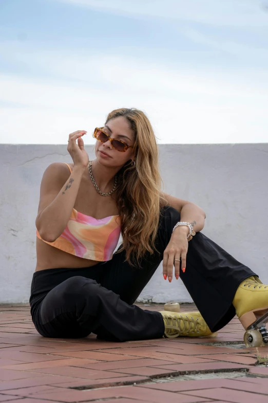 a woman wearing sunglasses holding onto a banana