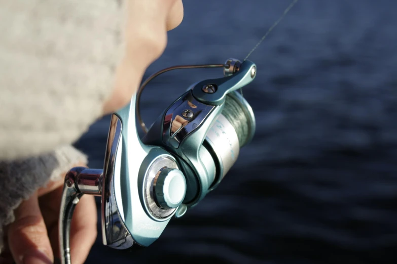 the back end of a fishing pole with a spinning reel