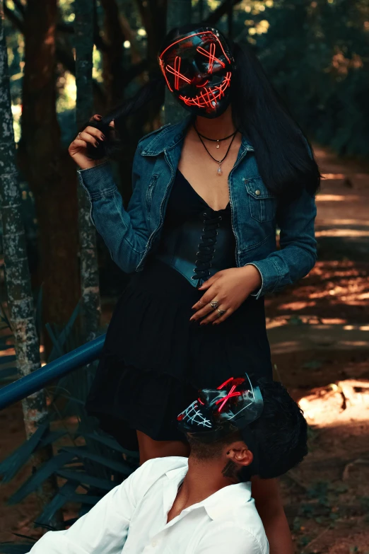 the woman is wearing a red mask and a dress