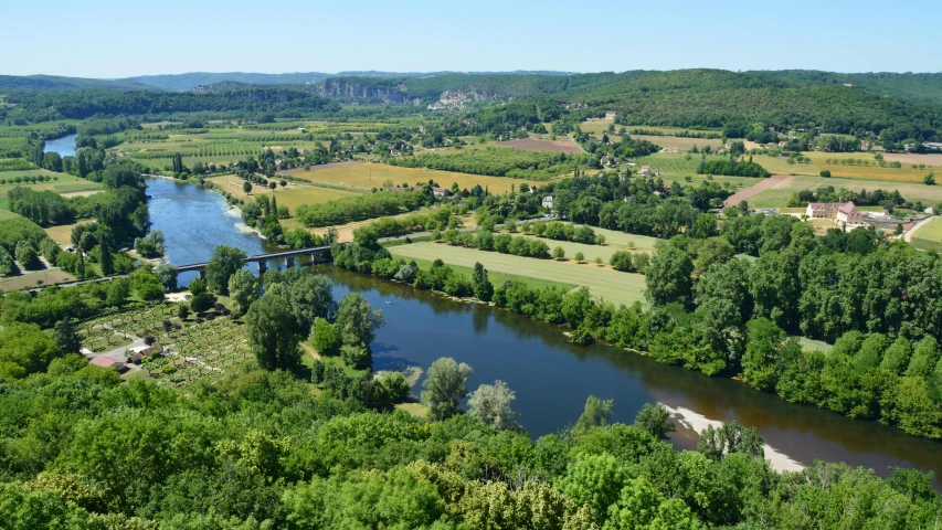 the countryside with several lakes and lush green trees