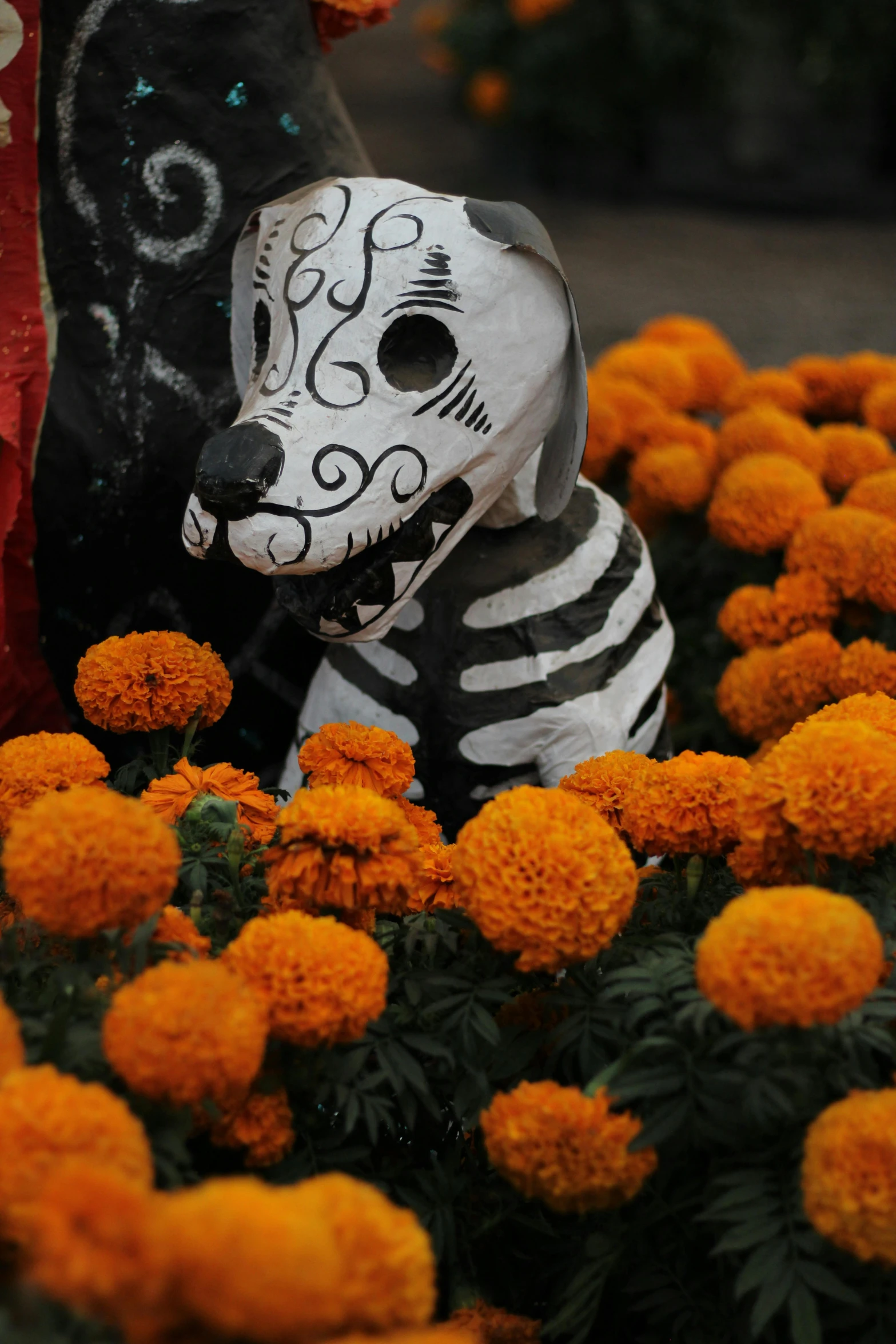 an animal that is sitting on some flowers