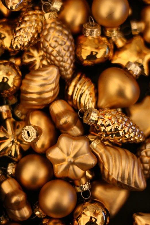 a background of shiny and shiny ornaments with a shiny star on top