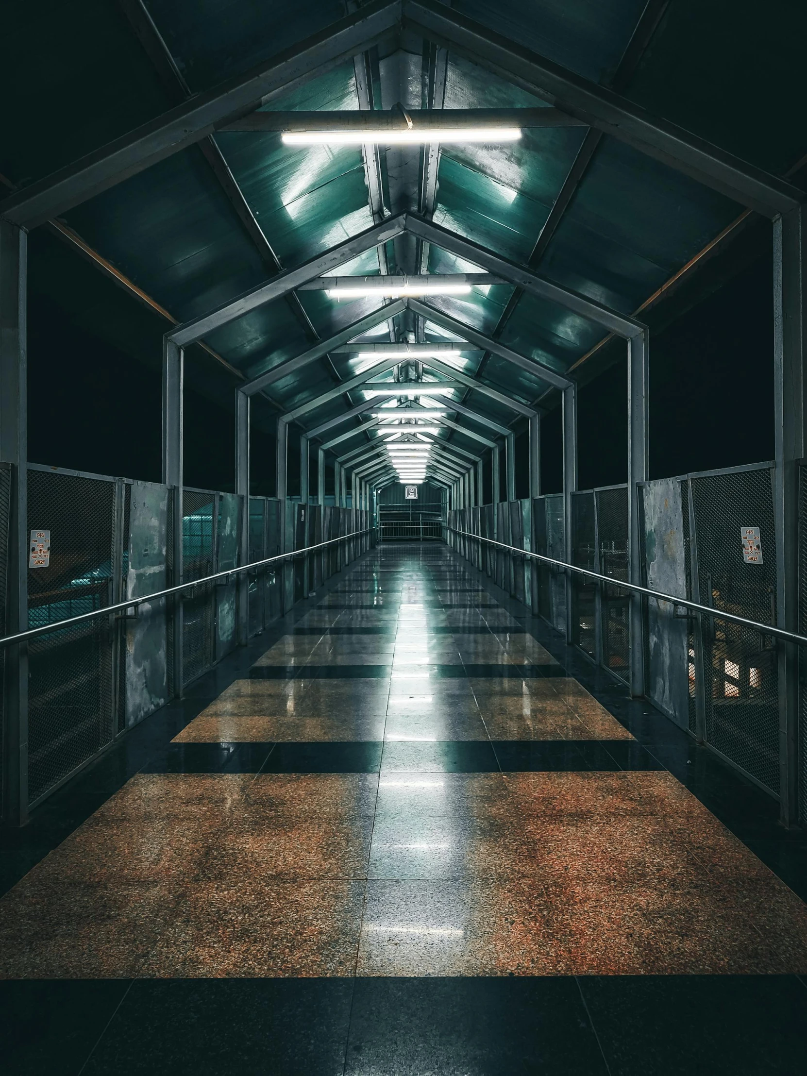 an empty, dark hallway with several doors