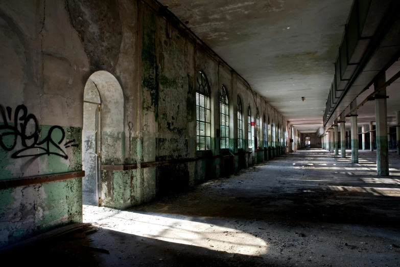 an abandoned building with lots of graffiti on the walls and floor