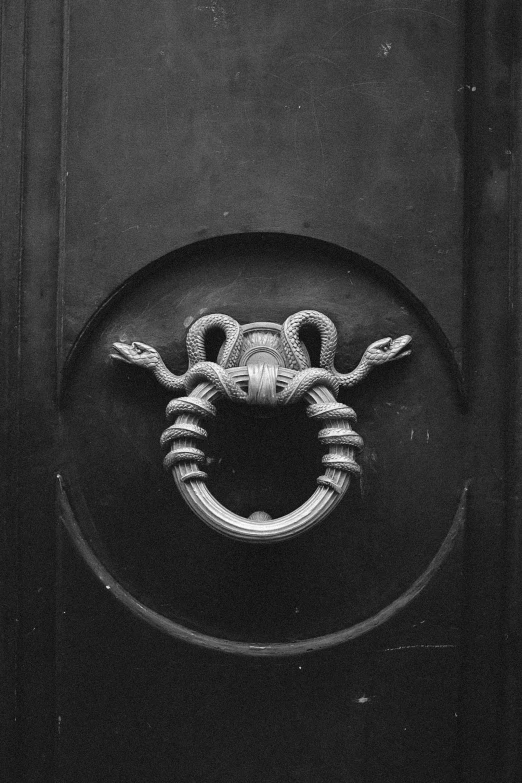 an image of black and white pograph of a door handle