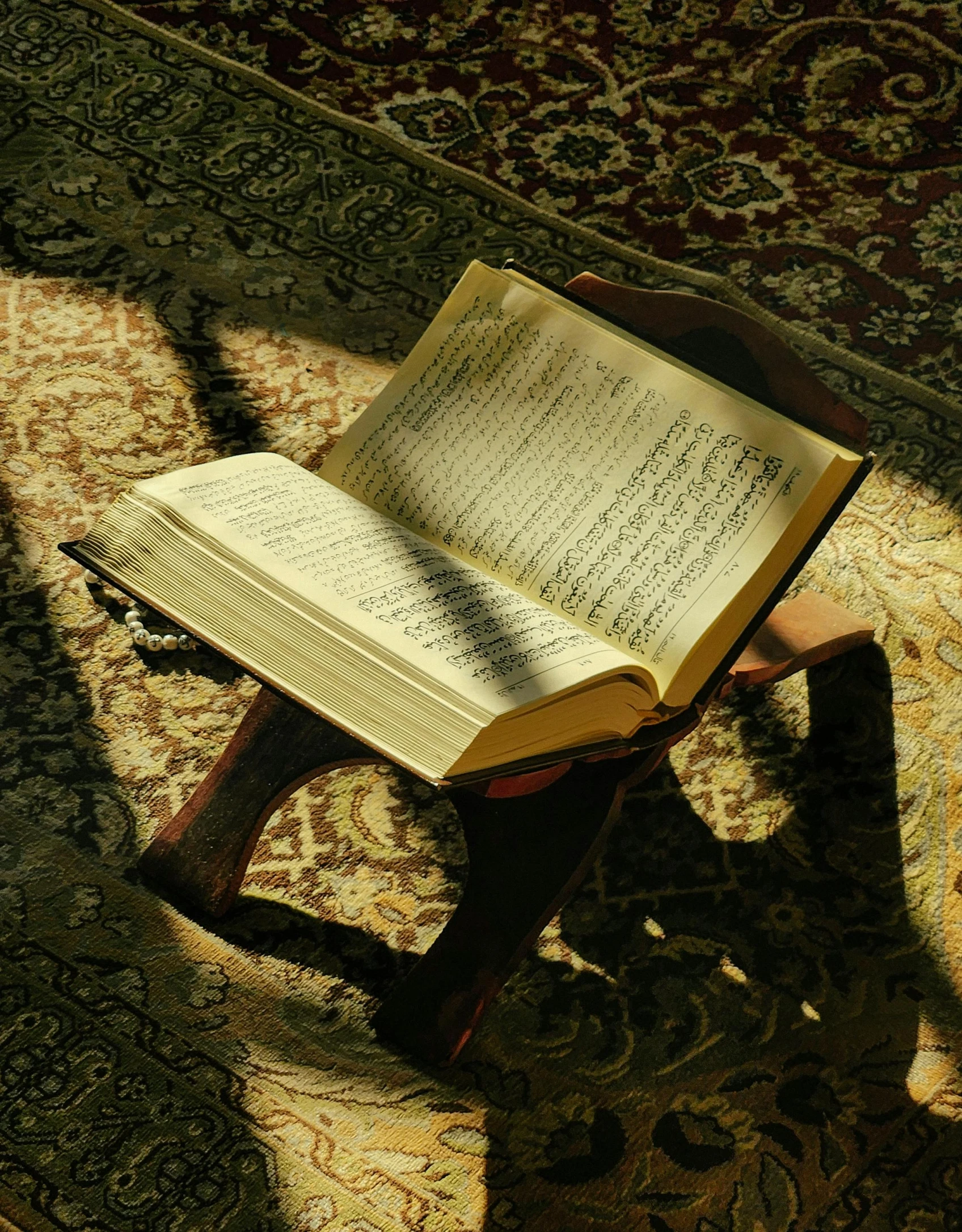 an open bible on a table in a room