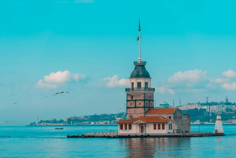 a small house is sitting out in the water