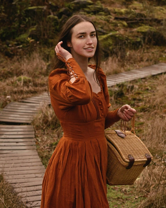 a woman in a red dress is on her cellphone