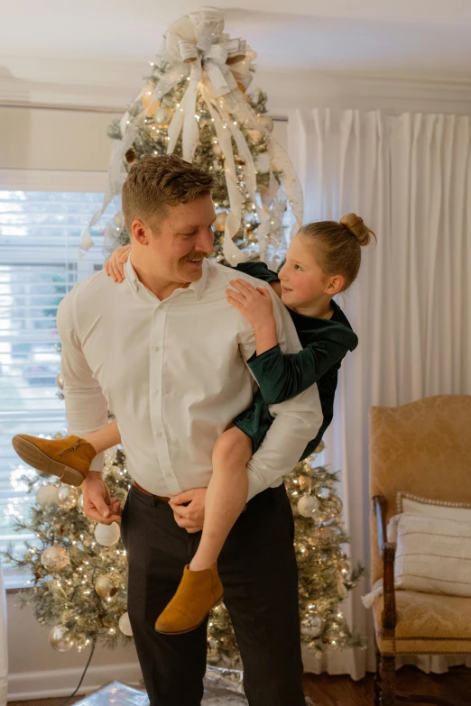 a man holds his young child close to the camera