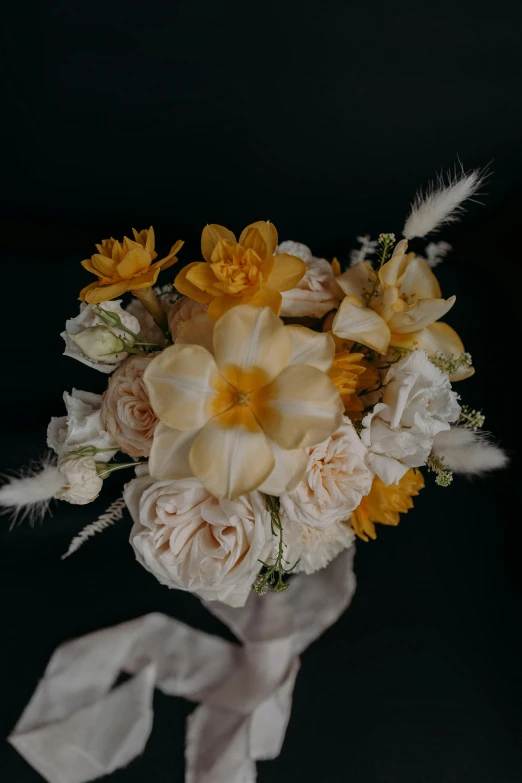 the bride's bouquet is adorned with flowers