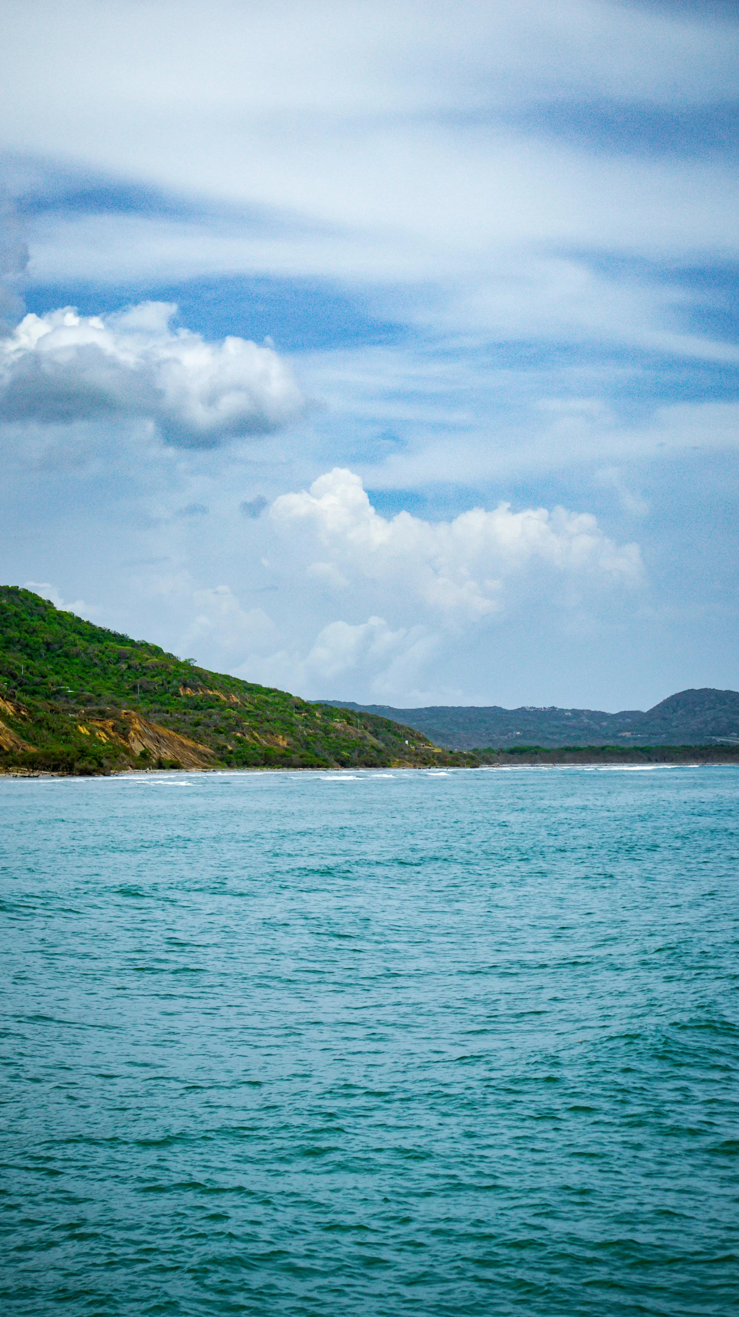 a man in a boat paddling the water