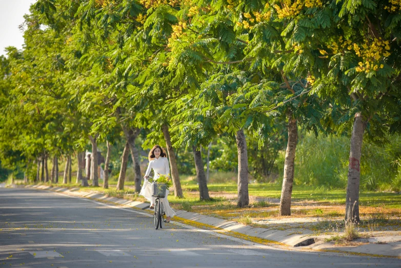 a woman is riding a bicycle on the road