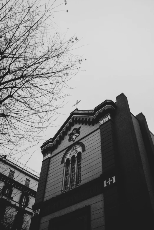 the top of the building has windows and a clock on it