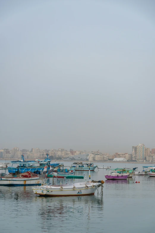 boats in the harbor during a hazy day