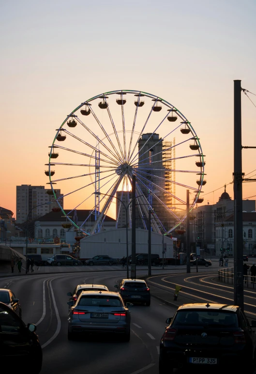 a large wheel sits in the middle of the highway