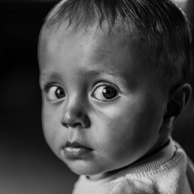 a black and white po of a baby