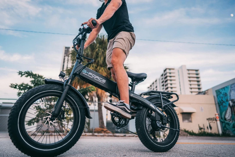 an older man riding a skate board on a motor bike