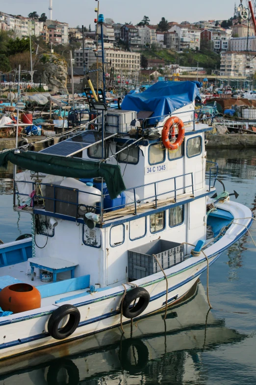 a small fishing boat sitting on the water