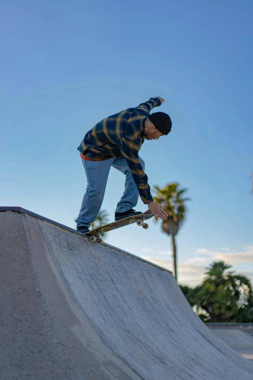 a person in the air on a skateboard doing a trick