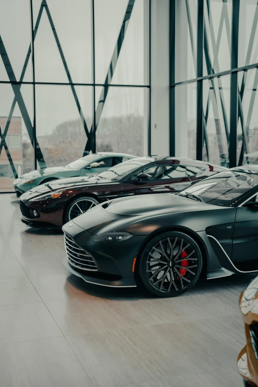 a couple of very nice looking cars in a room