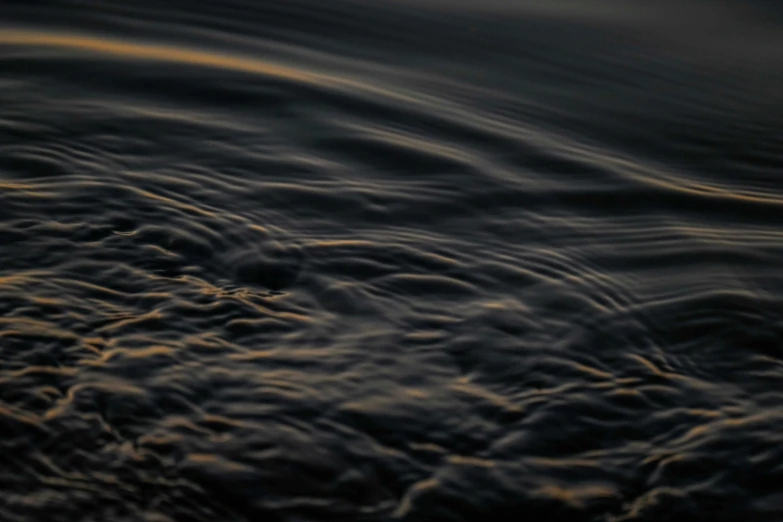 clouds above the water in an ocean with no one on the boat