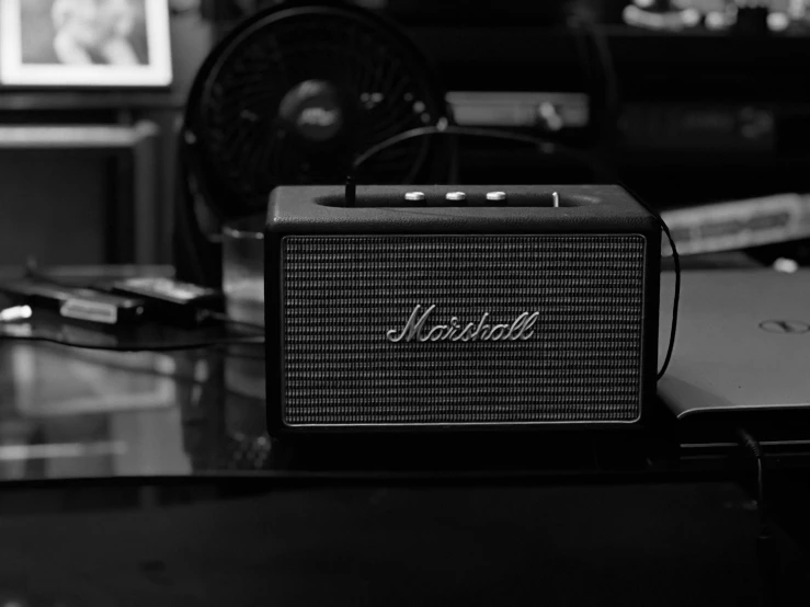 an old fashioned bluetooth radio sits on top of a table