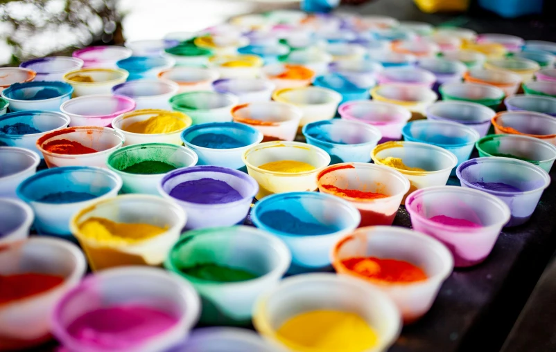 small cups are lined up in an assortment