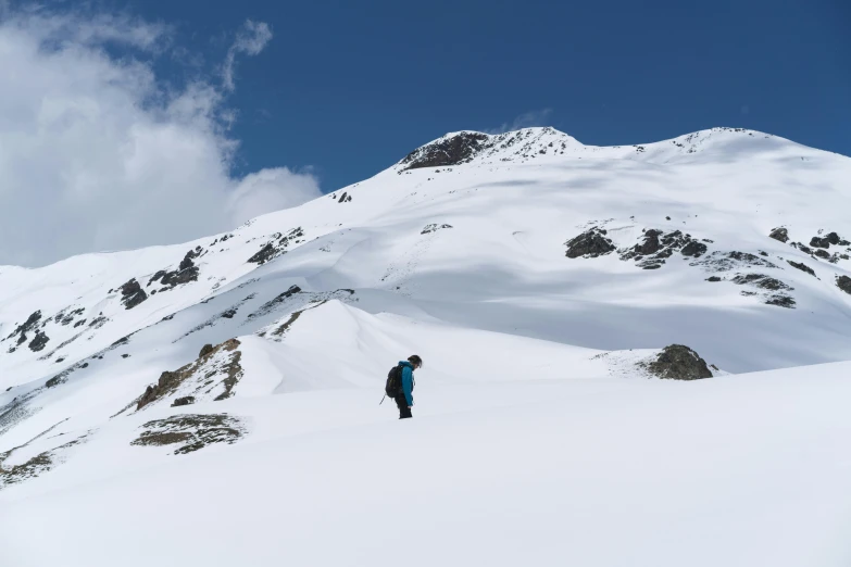 a snowboarder riding down the side of a mountain