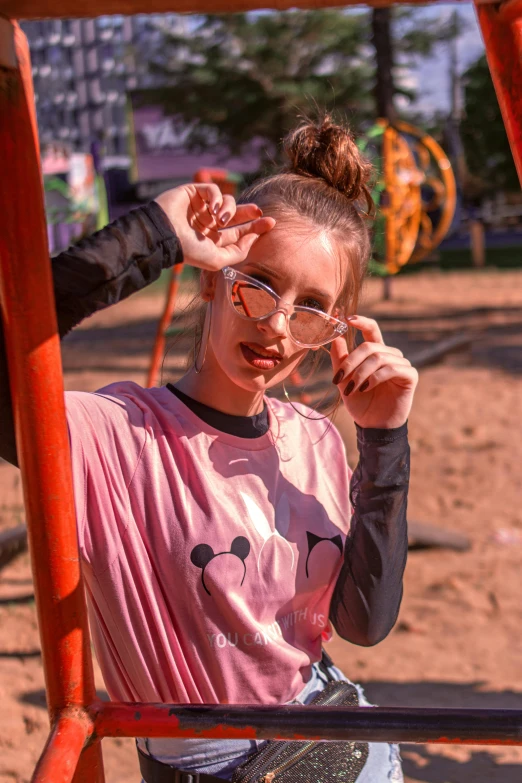 a person is standing on a swing with glasses