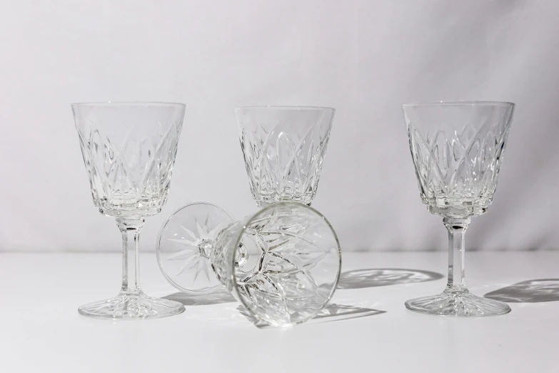 clear glassware displayed on white surface next to each other