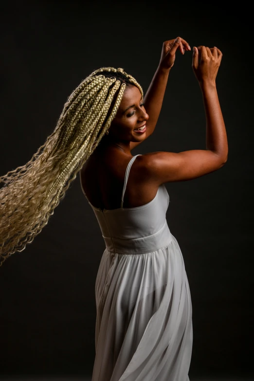 a woman with long hair is dancing