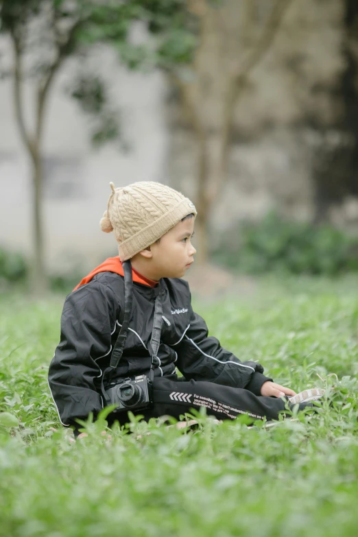  dressed in winter clothing and sitting down