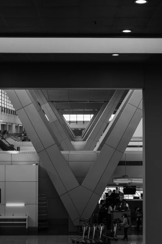 black and white pograph of luggage waiting at the airport