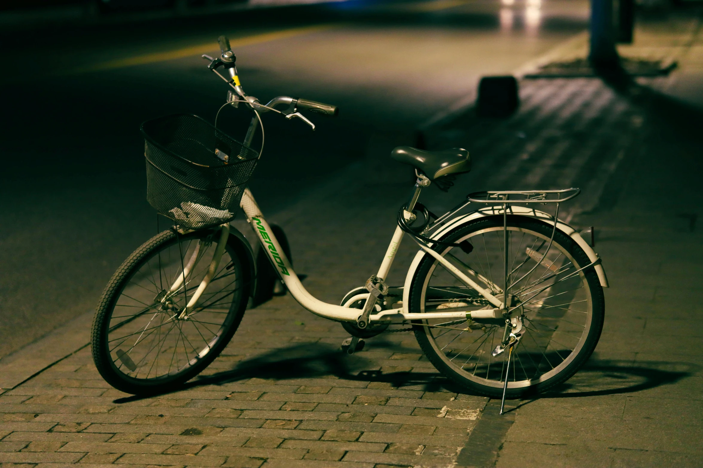 a bicycle that is  to a street curb