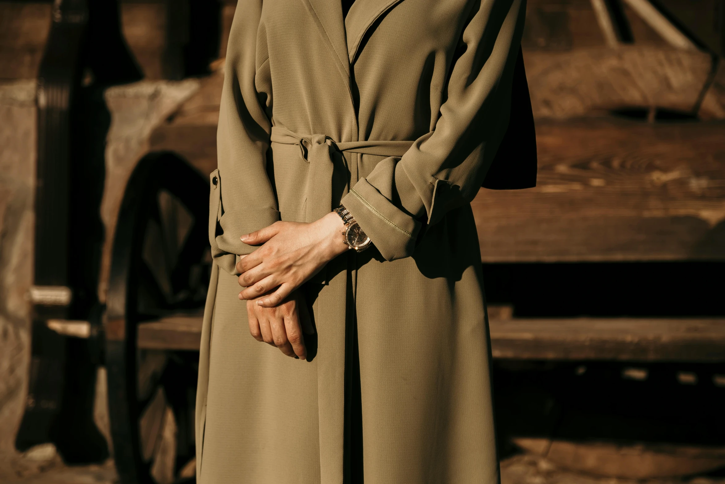 an old lady in a brown trench coat