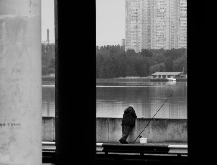 a man is standing at the edge of a dock