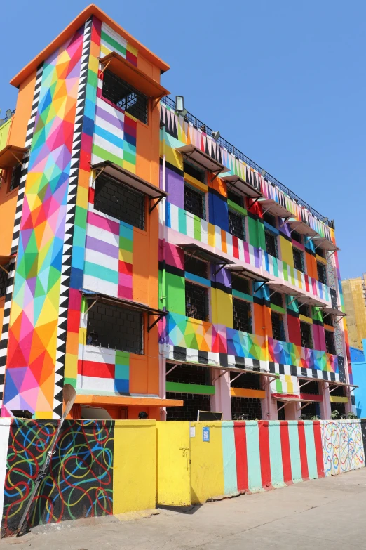 a colorful building with lots of windows and balconies