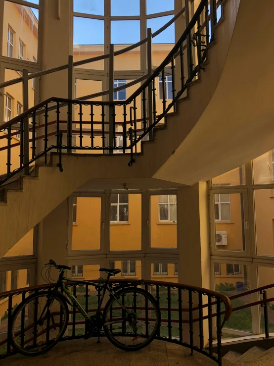 there is a bike parked on the stairs in a house