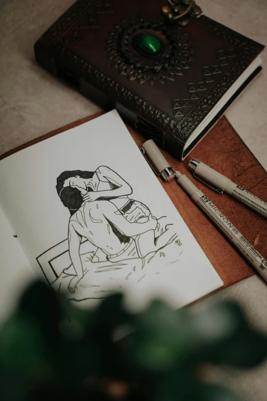 this picture is of a woman's hand sketching an image of herself