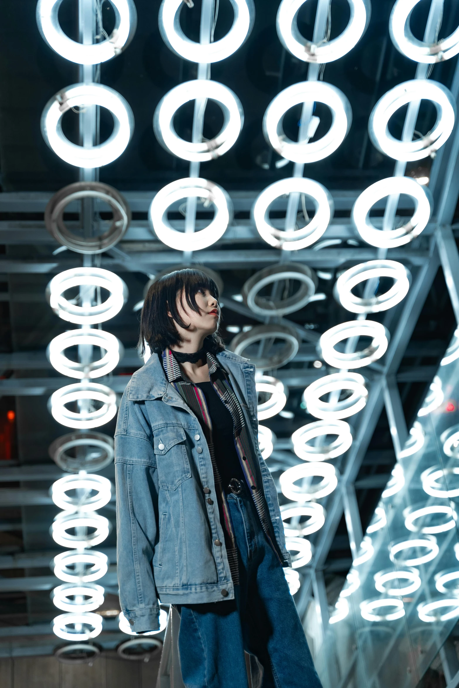 a man standing in front of some lights